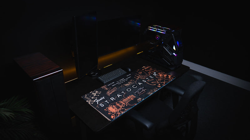 Wide view of the gold Fender Stratocaster Blueprint desk mat with patent-style hardware details
