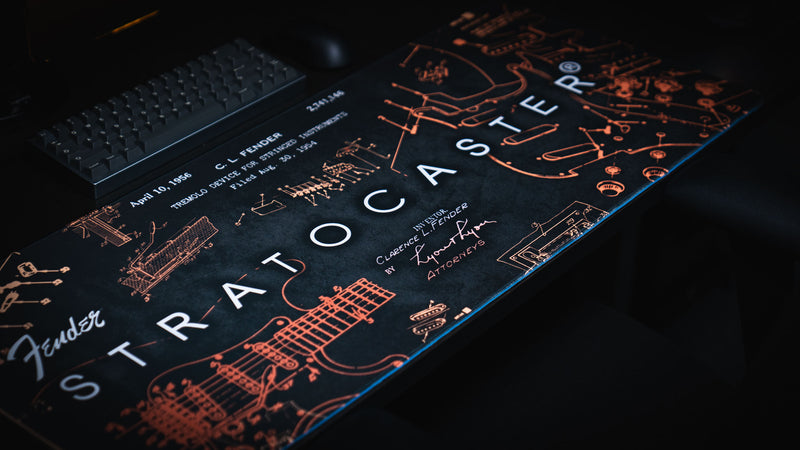 Gold Fender Stratocaster Blueprint desk mat with technical artwork across an extended mouse surface