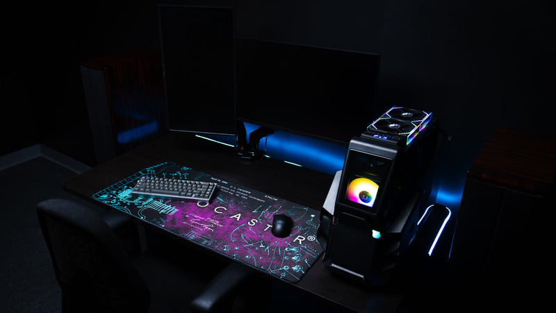 Purple Fender Stratocaster Blueprint XXL desk mat shown beneath a keyboard and mouse in a desktop setup