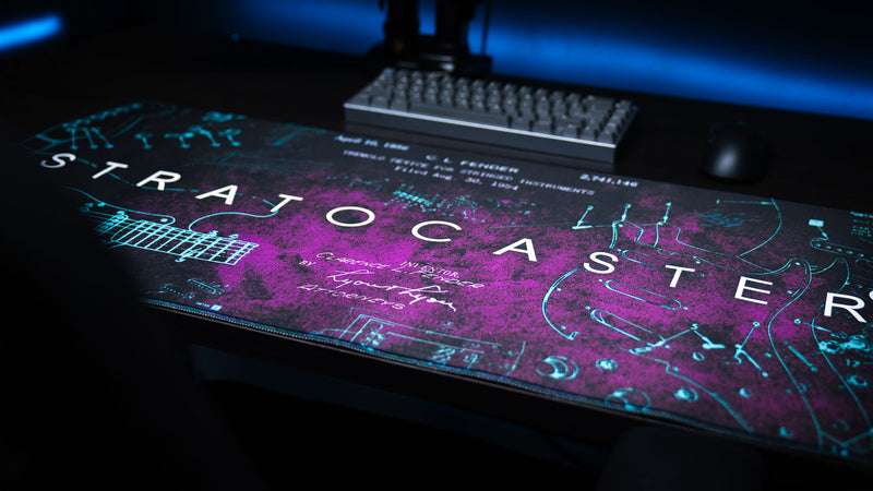 Purple Fender Stratocaster Blueprint desk mat with technical instrument artwork
