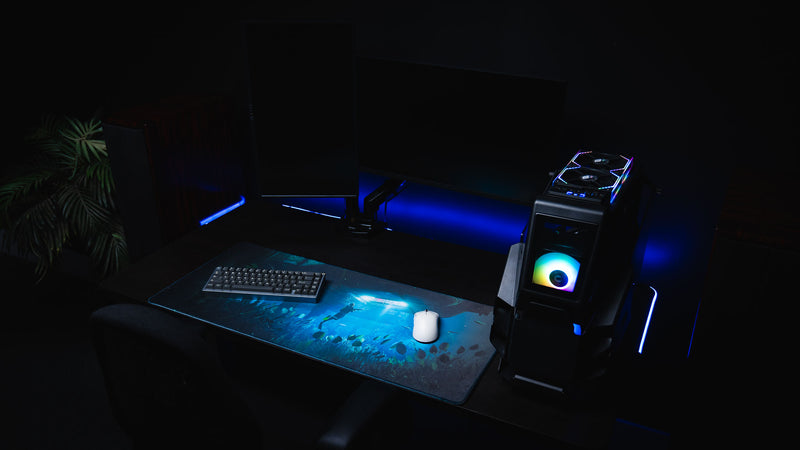 Official Rust Labs Breach deskmat displayed in a premium gaming setup, featuring an underwater diver exploring the Labs monument beneath the ocean with dramatic blue lighting and marine life.