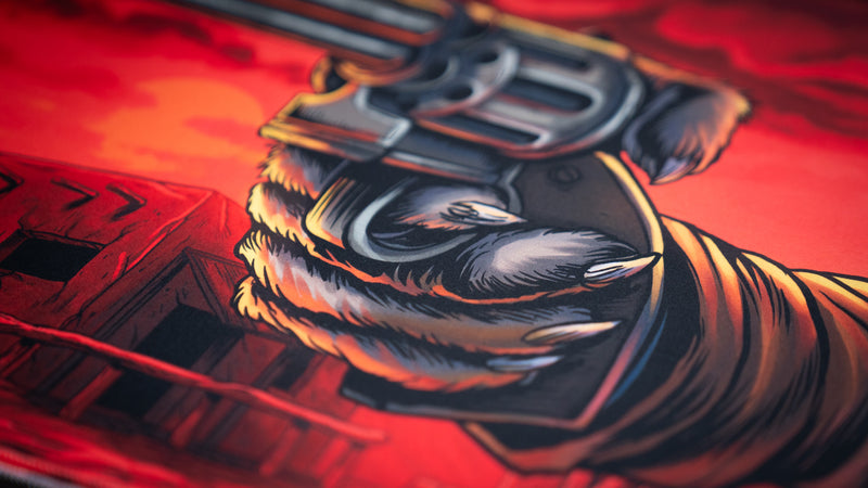 Close-up of the cat's gloved hand holding a revolver in the red sunset artwork on Only PVP Cat deskmat.