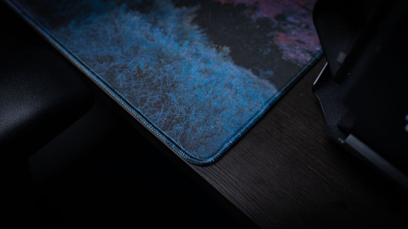 Close-up of the Parus Trail deskmat corner featuring premium stitched edges, detailed desert vegetation, and high-resolution Zion National Park landscape photography.