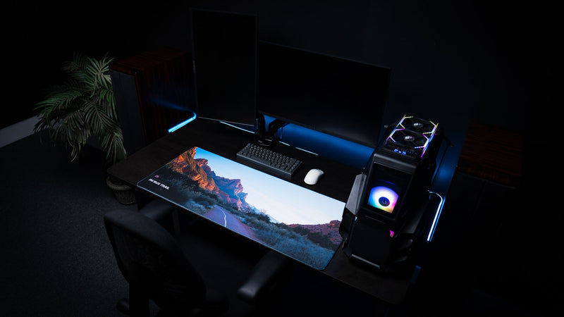 Parus Trail deskmat displayed in a premium desktop gaming setup, showcasing the scenic hiking trail and towering sandstone cliffs of Zion National Park with vibrant natural colors.