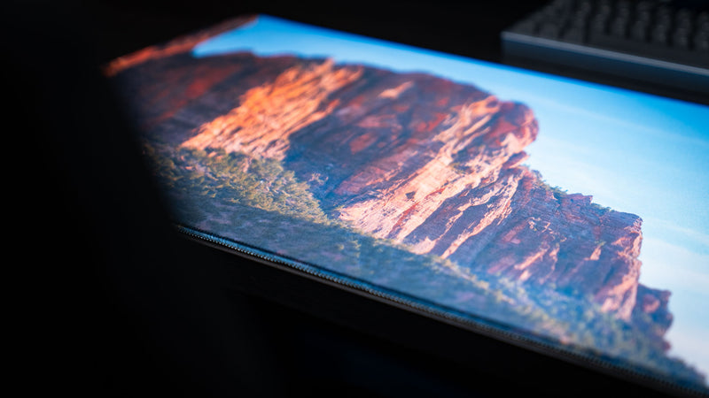 Close-up of the Patriarch Peak deskmat highlighting Zion National Park's towering sandstone cliffs, vibrant HD landscape photography, premium stitched edges, and smooth gaming surface.