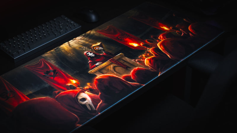 Angled view of the Pravus Crimson Convocation deskmat featuring a masked cult leader addressing crimson-robed followers in a dramatic fantasy cathedral scene.