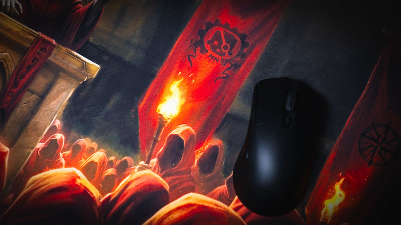Close-up of the Pravus Crimson Convocation deskmat featuring crimson banners, torchlit cult followers, and a gaming mouse highlighting the detailed dark fantasy artwork.