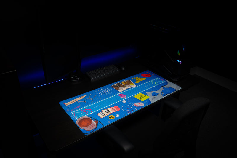 Angled view of Replaymode The Tunnel deskmat on a gaming desk
