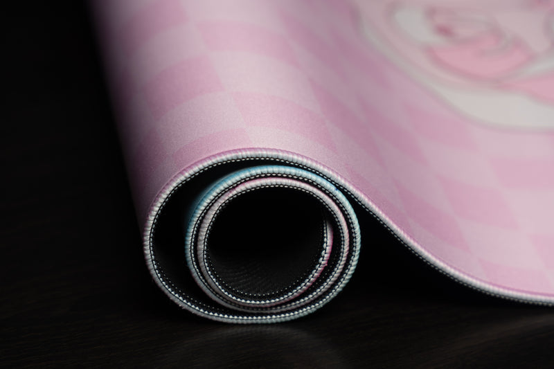 Close-up of the rolled edge and stitching of Rosy Racer's Full Bloom desk mat.