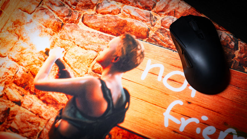 Close-up of The Doorcamper / Angle 3 Rust deskmat featuring the iconic "Not Friendly!!" warning sign beside a survivor, displayed with a gaming mouse on a premium stitched-edge deskmat.