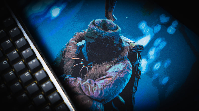 Close-up of the official Rust Hunted XXL deskmat showcasing the lone survivor artwork on a premium stitched-edge cloth gaming deskmat with vibrant high-definition printing.