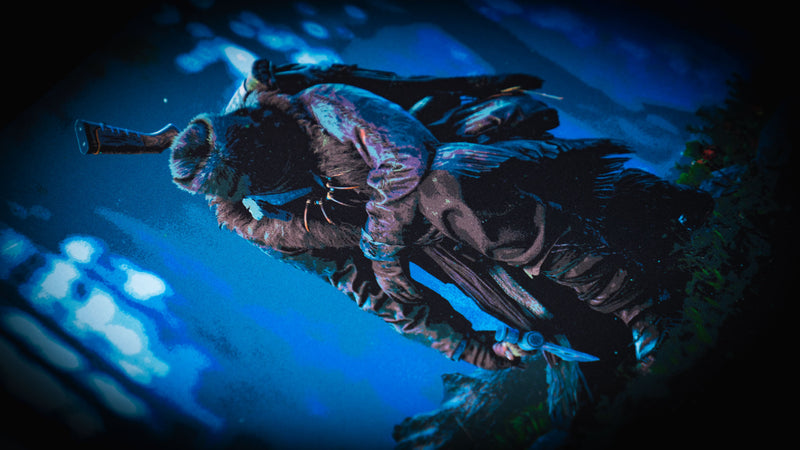 Close-up of the official Rust Hunted XXL deskmat featuring a lone survivor with a knife in a moonlit forest, printed on a premium stitched-edge cloth gaming deskmat.