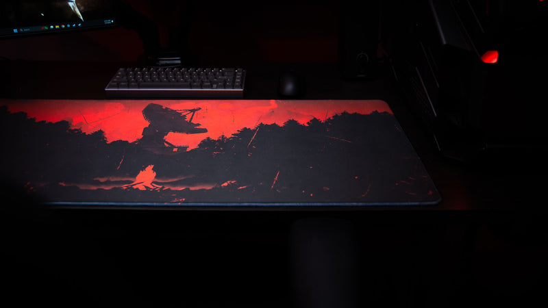 Satellite Dish Rust gaming deskmat featuring a red sky, forest silhouettes, and satellite dish artwork in a dark atmospheric PC setup.