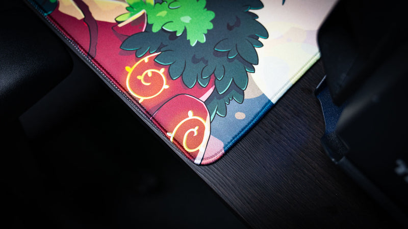 Close-up of the Sedi-mat deskmat by Pokedex Studios showcasing premium stitched edges, vibrant fantasy artwork, and a durable gaming mouse pad surface.