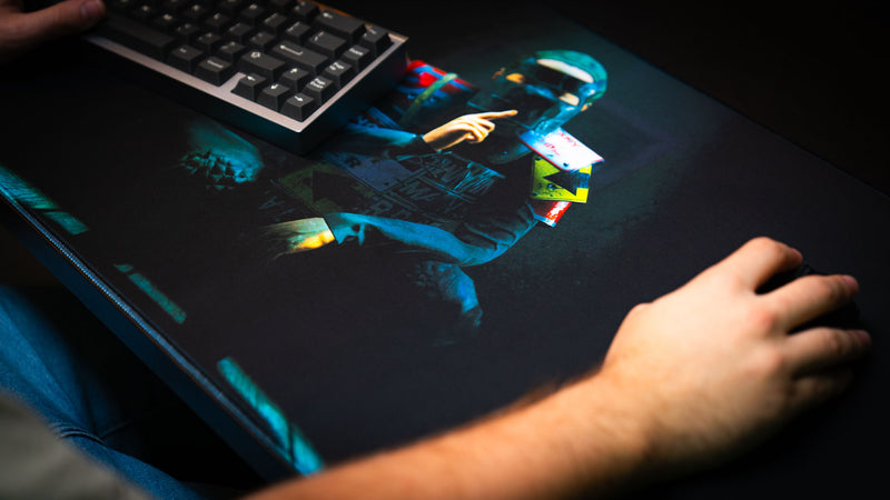 Player using the Shh Rust deskmat during gameplay, showcasing the smooth tracking surface, premium print quality, and immersive masked character artwork.