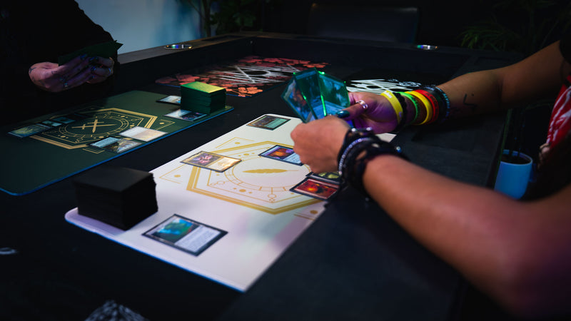 Player using the Feathered Host playmat during a trading card game