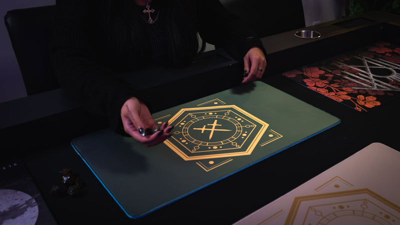 House Veridian playmat with its gold crossed-swords design during a tabletop game