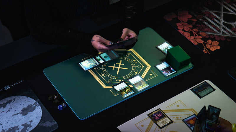 Player holding cards over the House Veridian playmat during a trading card game