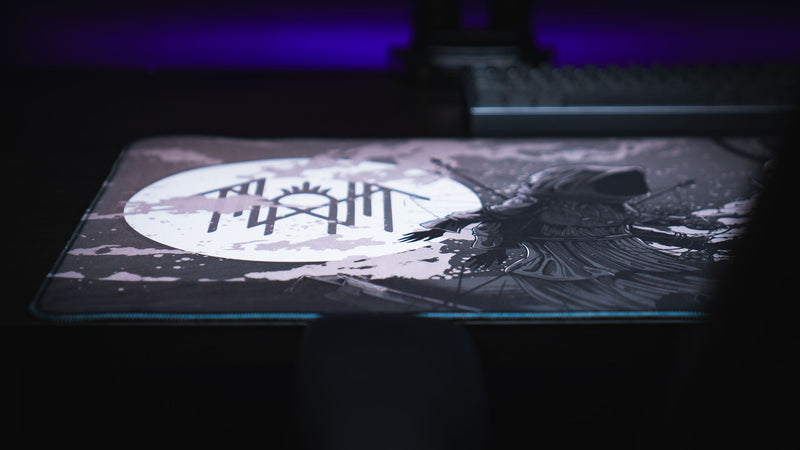 Close-up of the white moon and Sleep Token sigil on The Battle deskmat