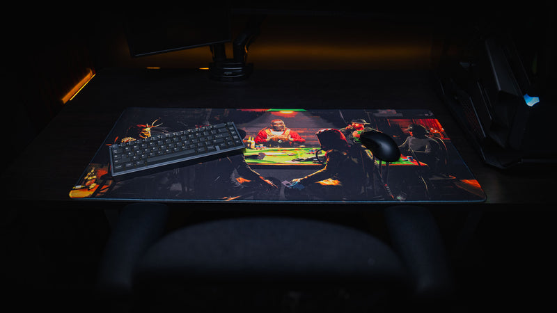 Sleight of Hand Rust gaming deskmat displayed on a gaming desk with a mechanical keyboard and mouse, featuring survivors playing poker in a dimly lit cabin.