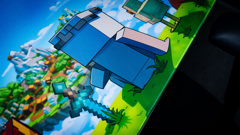 Close-up of a blue block-style character and pixel sword overlooking a floating island on the Something Like That creator collaboration deskmat.