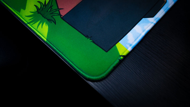 Close-up of the stitched edge and premium surface material on the Something Like That creator collaboration deskmat, showcasing craftsmanship and durability.