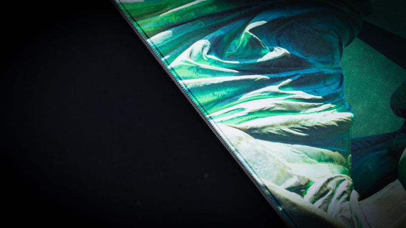 Close-up of the America 250 Statue of Liberty deskmat highlighting the detailed robe artwork, vibrant green tones, high-definition print, and premium stitched-edge finish.