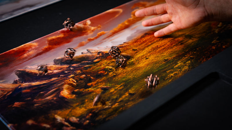 Dice rolling across the Sunspire Plains fantasy playmat, featuring golden grasslands, rocky terrain, and a dramatic sunset sky.