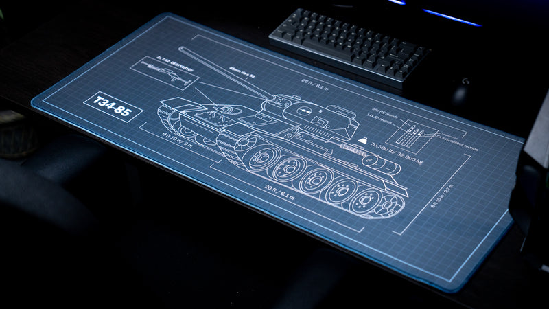 Jimarkus T-34 Schematic gaming deskmat displayed on a desktop, featuring a detailed T-34-85 blueprint with technical callouts and measurements.