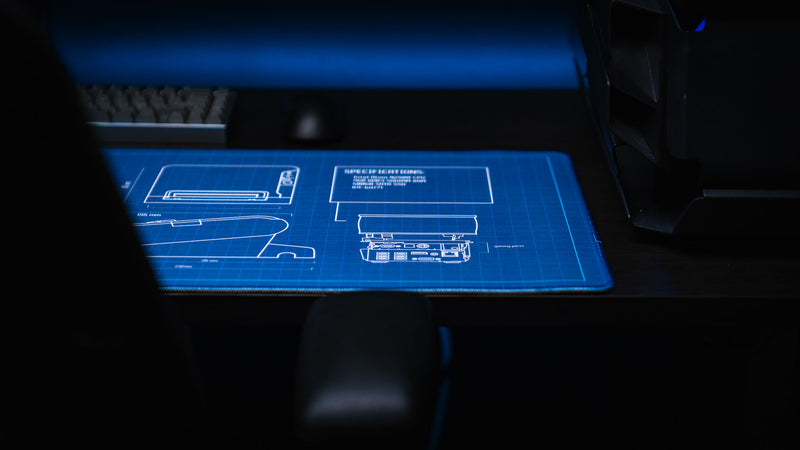 Rear detail view of the Thermal Receipt Printer blueprint deskmat by Bringus, showcasing technical specifications, rear port diagram, and blueprint illustrations on a premium extended gaming mouse pad.