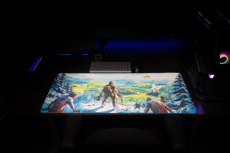 Front view of Torak's Dead Horizon desk mat on a dark gaming desk beneath a keyboard and mouse.