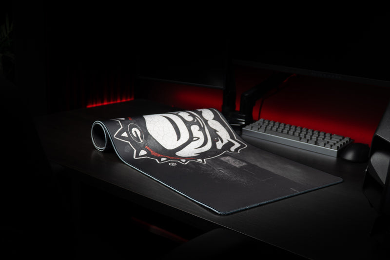 Georgia Bulldogs Home Turf deskmat partly rolled beside a keyboard.