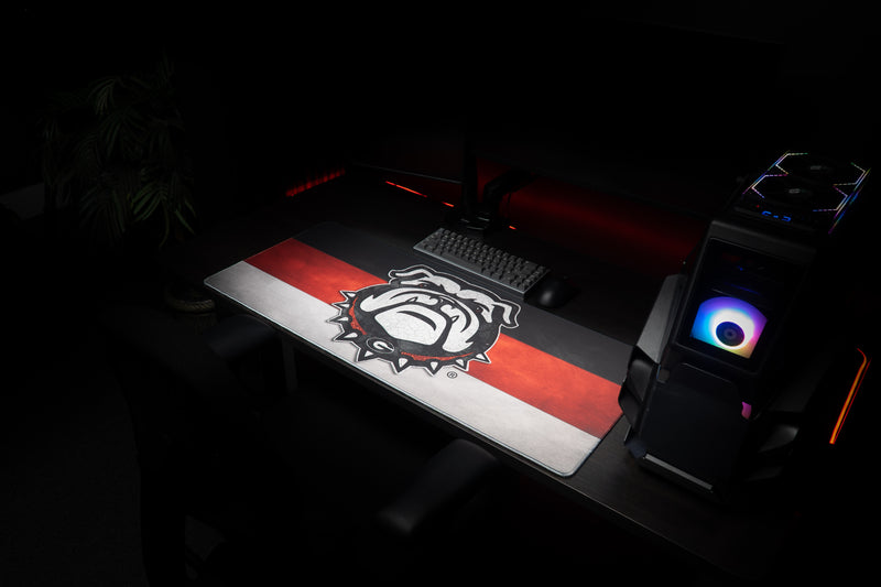 Georgia Bulldog's Pride deskmat at an angle across a gaming workstation.