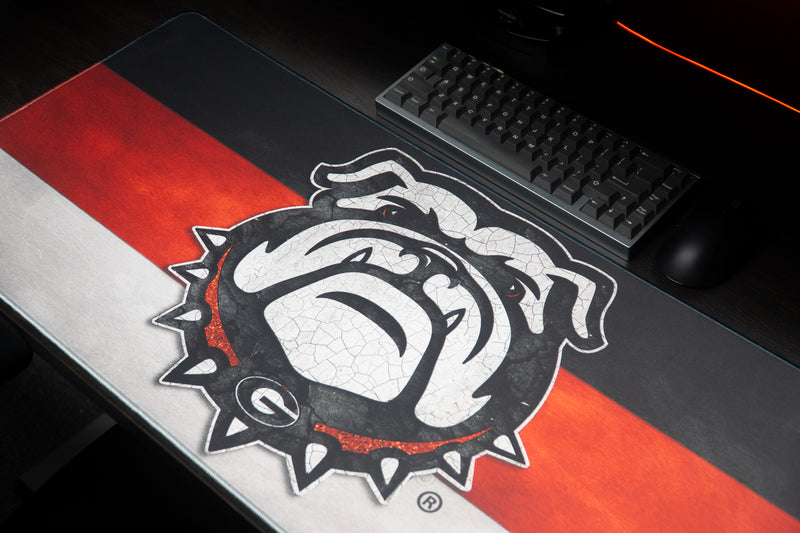 Close-up of the white bulldog mascot on the Georgia Bulldog's Pride deskmat.