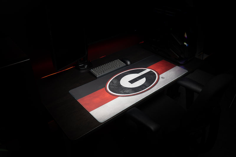Side view of the Georgia Pride deskmat in a dark gaming workstation.