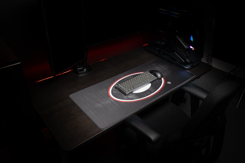 Angled view of the University of Georgia Grit deskmat beneath a keyboard and mouse.