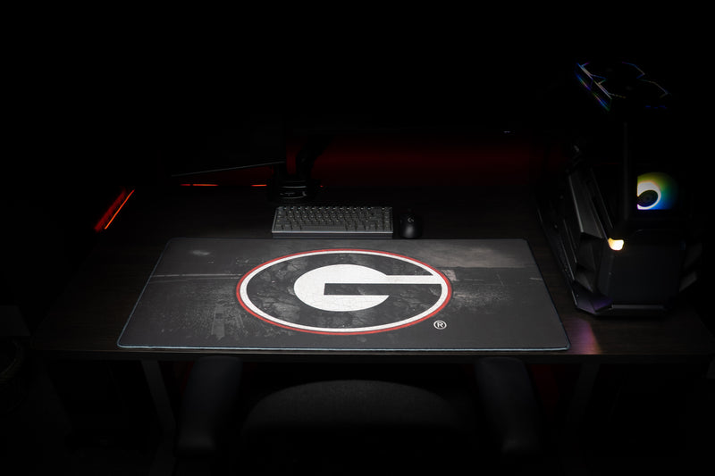Front desk view of the University of Georgia Home Turf deskmat beneath a keyboard.