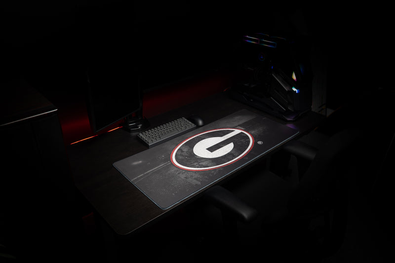 Side view of the Georgia Home Turf deskmat in a dark gaming workstation.