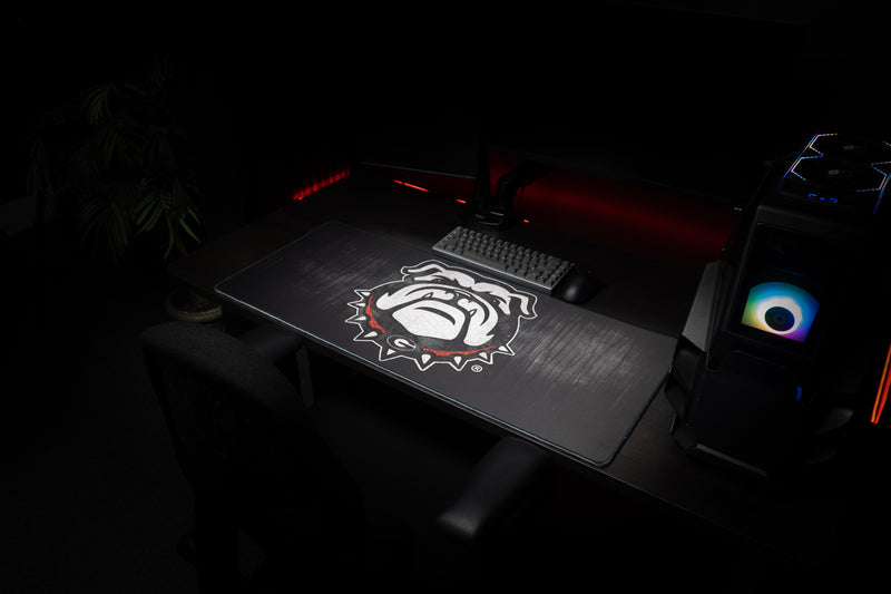 Georgia Mark of the Bulldog deskmat at an angle across a gaming workstation.