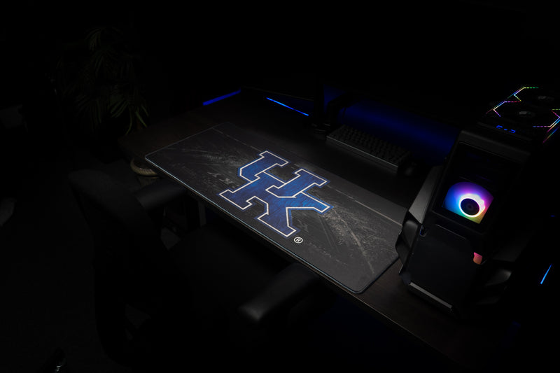 Kentucky Home Turf deskmat laid out at an angle in a dark gaming workstation.