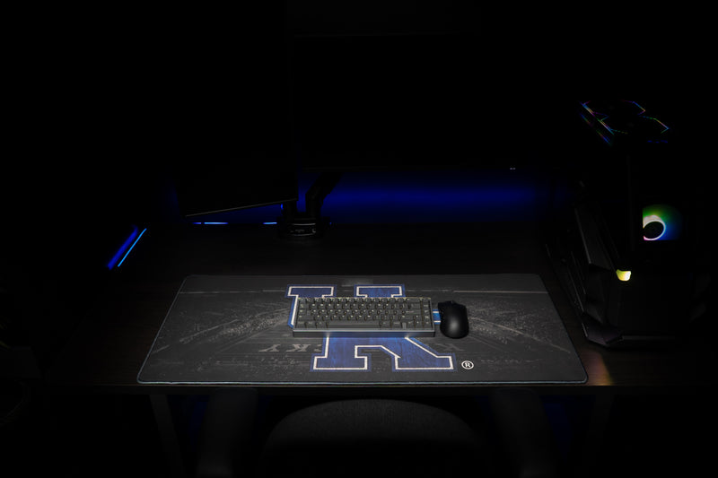Keyboard and mouse on the Kentucky Home Turf deskmat in a gaming setup.
