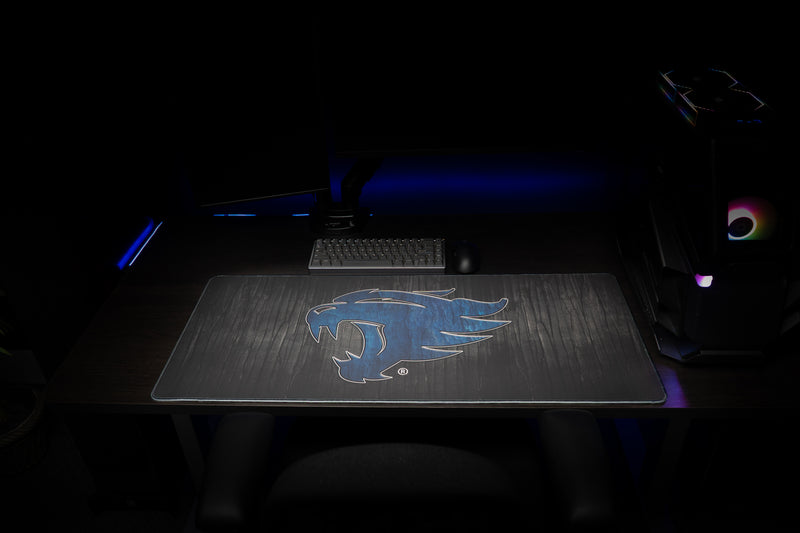 Front view of the Kentucky Mark of the Wildcat deskmat in a dark gaming setup.