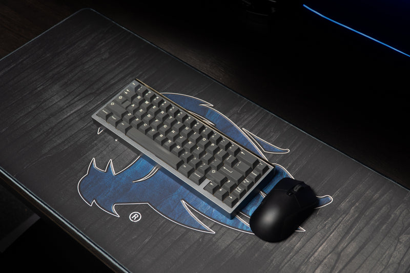 Keyboard and mouse on the Kentucky Mark of the Wildcat deskmat with blue wildcat artwork.