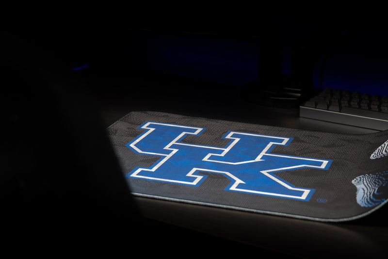 Angled view of the Kentucky Sound Wave deskmat highlighting the large blue UK logo.