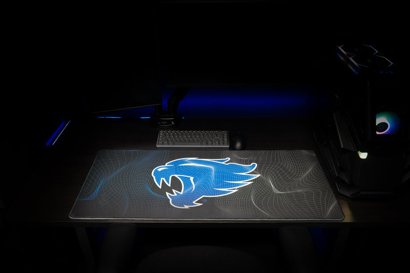 Front view of the Kentucky Wildcat Afterglow deskmat beneath a keyboard.
