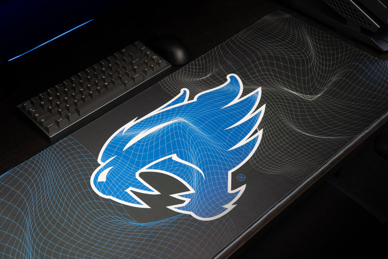 Close-up of the blue wildcat head on the Kentucky Wildcat Afterglow deskmat.