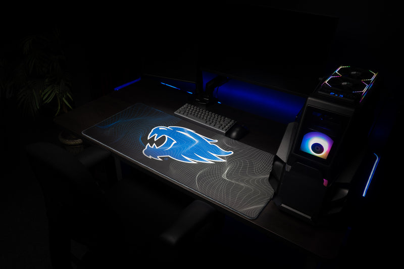 Kentucky Wildcat Afterglow deskmat displayed across a dark gaming workstation.
