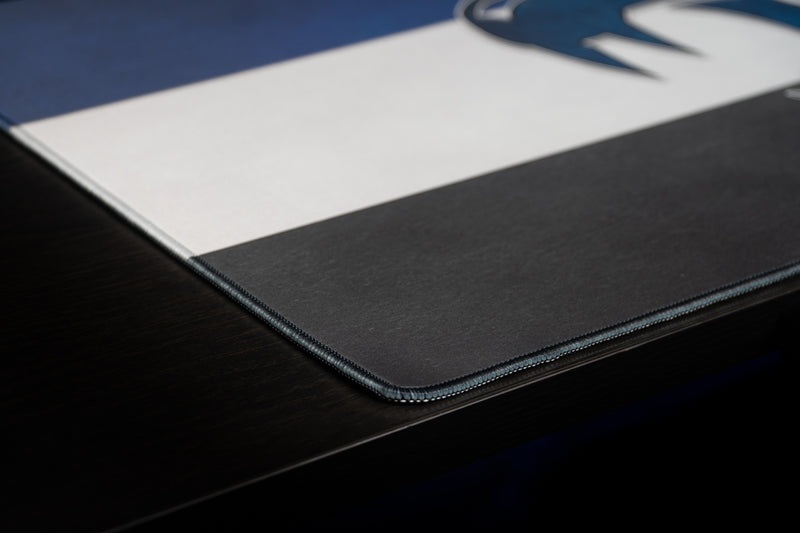 Close-up of the Kentucky Wildcat Pride deskmat's stitched corner and striped surface.