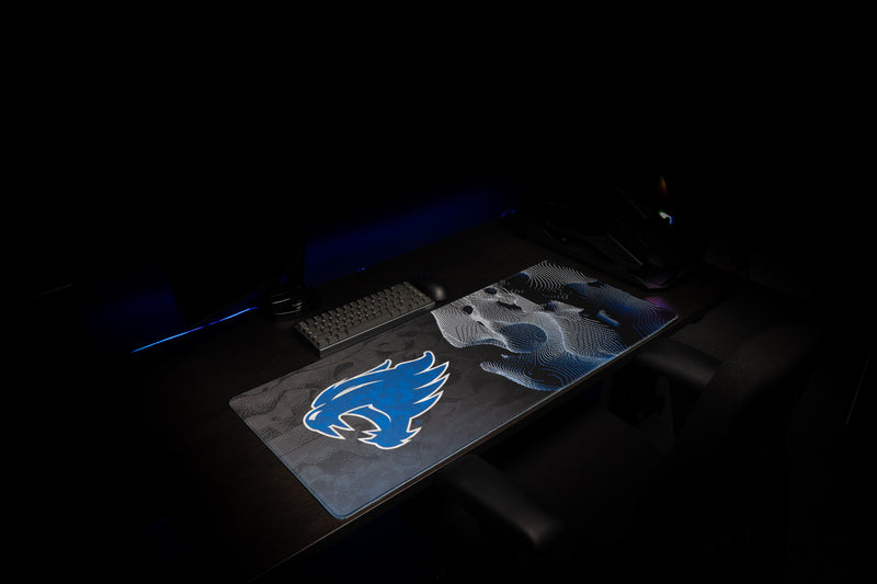Angled view of the Kentucky Wildcat Soundwave deskmat in a gaming setup.