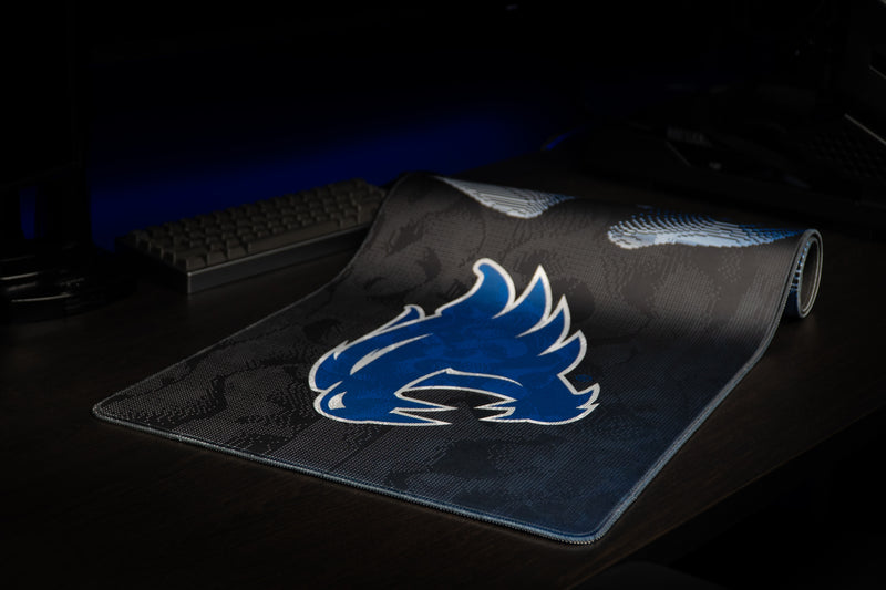 Kentucky Wildcat Soundwave deskmat partly rolled, displaying its blue wildcat design.